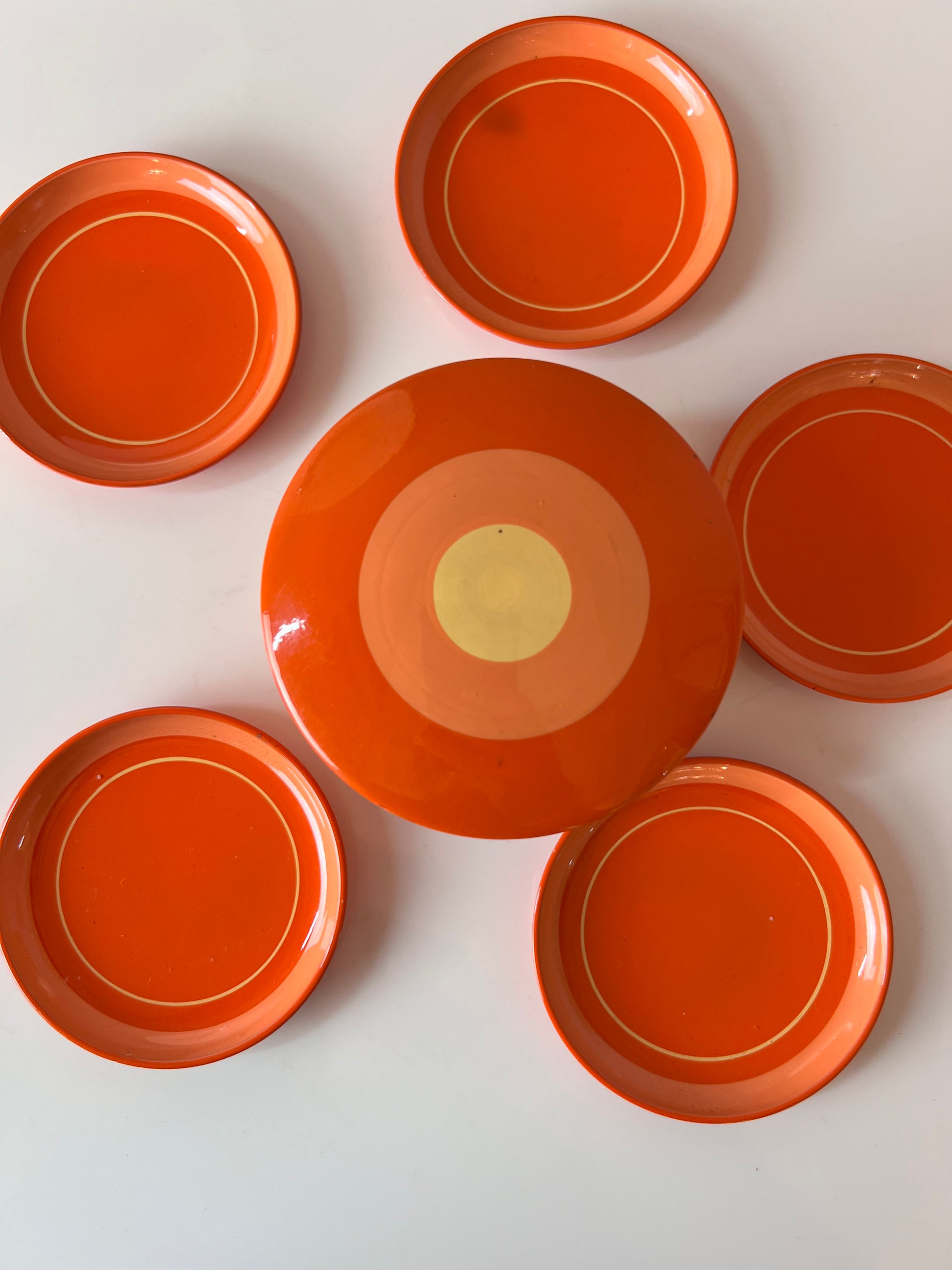 Set: Untersetzer in Dose orange Metall