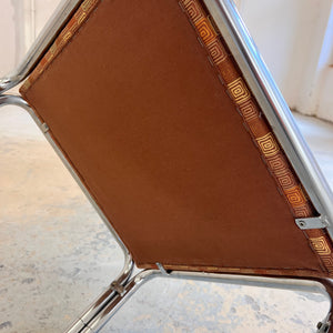 Hocker Chrom mit orange braunem Polster