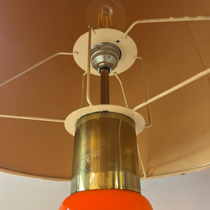 Bodenlampe orange Glas mit leuchtendem Fuß