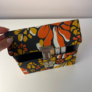 Aufbewahrungsbox für Kassetten orange braun gelb