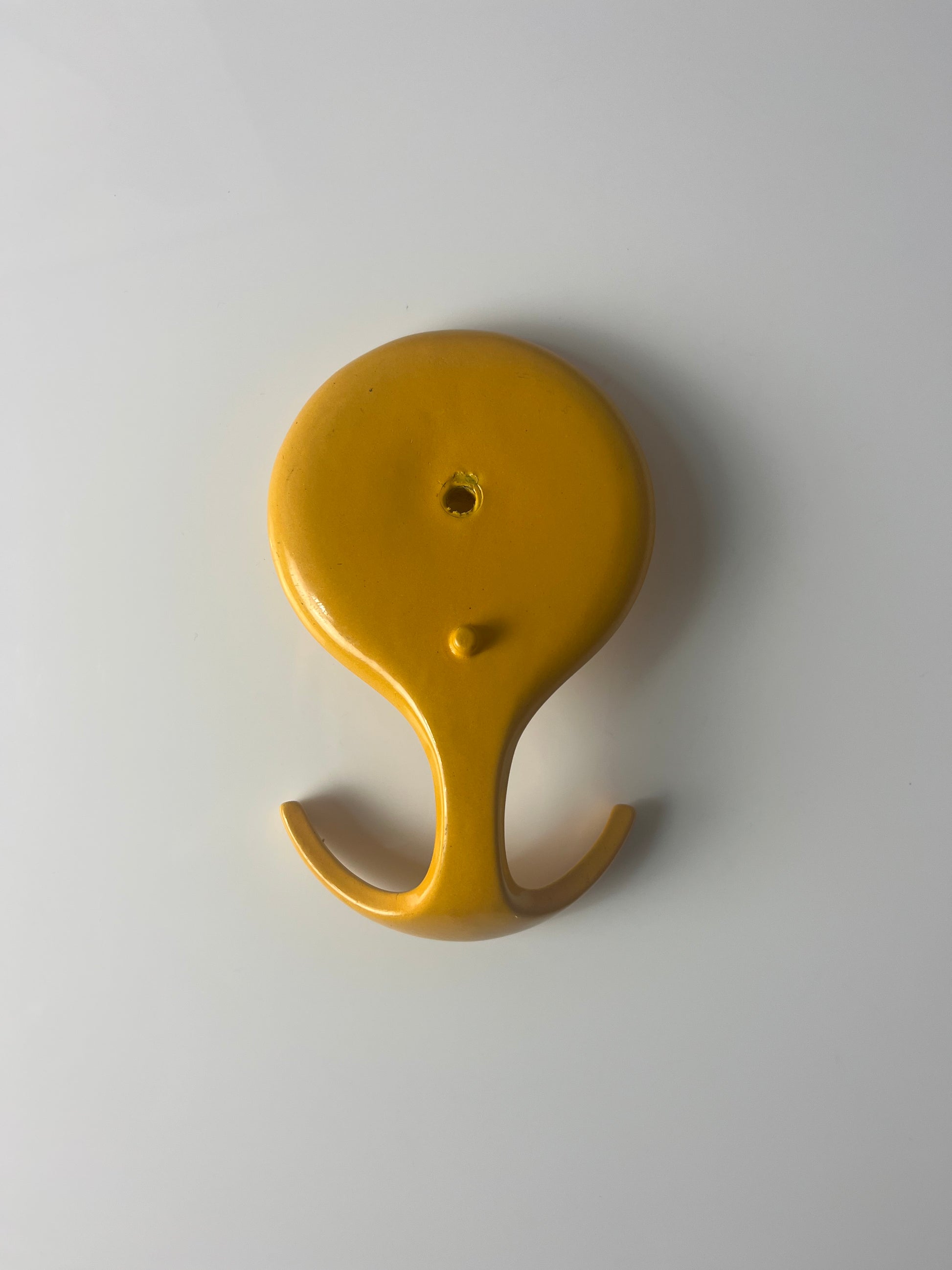 Wandhaken gelb Metall